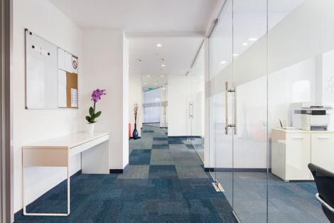 Interface Cubic carpet tile in office hallway
