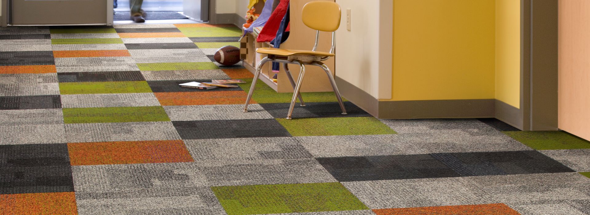 Interface Cubic and Cubic Colours in elementary school entryway with students walking through doors