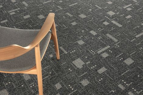 Detail image of Interface DL903 carpet tile with chair