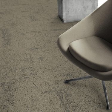 Detail of Interface DL905 carpet tile with chair