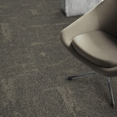 Detail of Interface DL907 carpet tile with chair imagen número 1