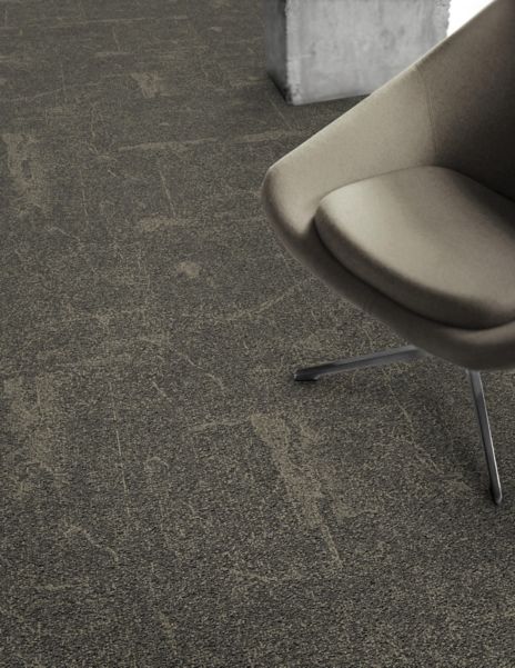 Detail of Interface DL907 carpet tile with chair