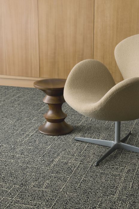 Interface DL925N carpet tile with chair and wood side table