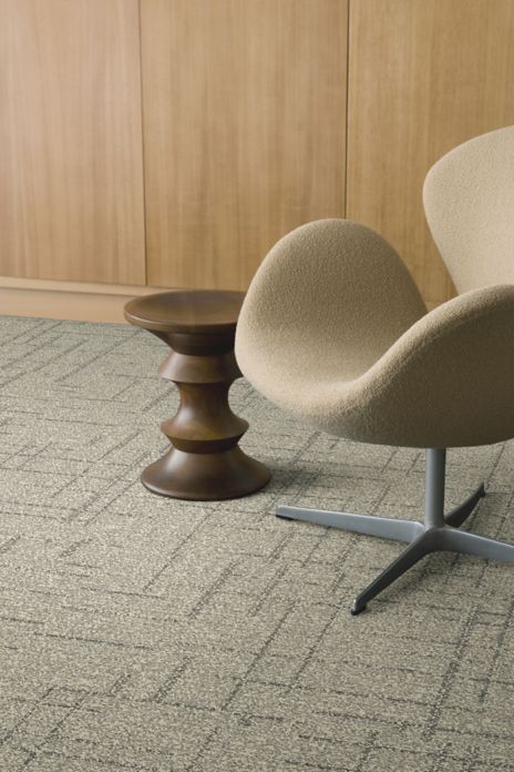 Interface DL925 carpet tile with chair and wood side table