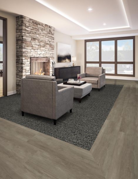Interface Diamond Dream plank carpet tile and Textured Woodgrains LVT in hotel room lounge area