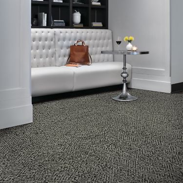 Interface Diamond Dream plank carpet tile in small seating area with couch and glass table imagen número 1