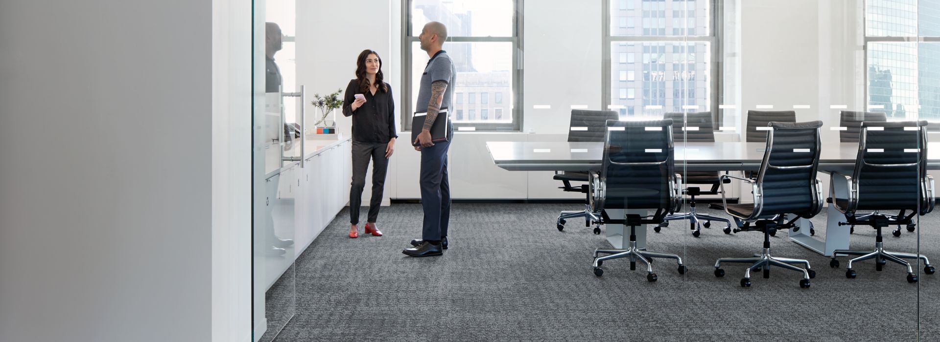 Interface Dover Street and Mercer Street carpet tile in open meeting room with glass doors