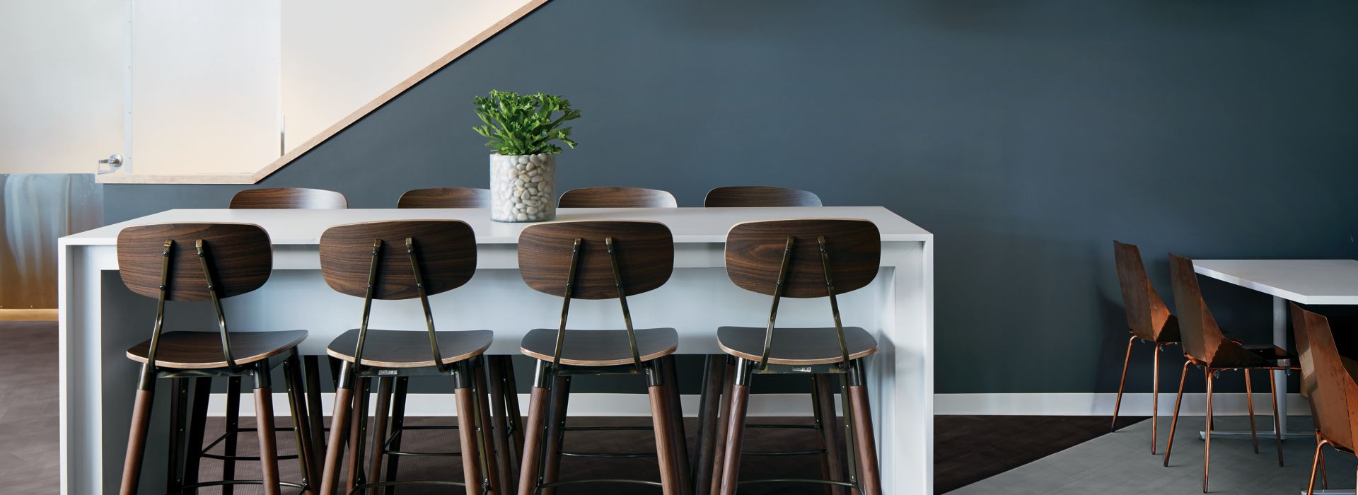 Interface Drawn Lines LVT in office common area with high table and chairs