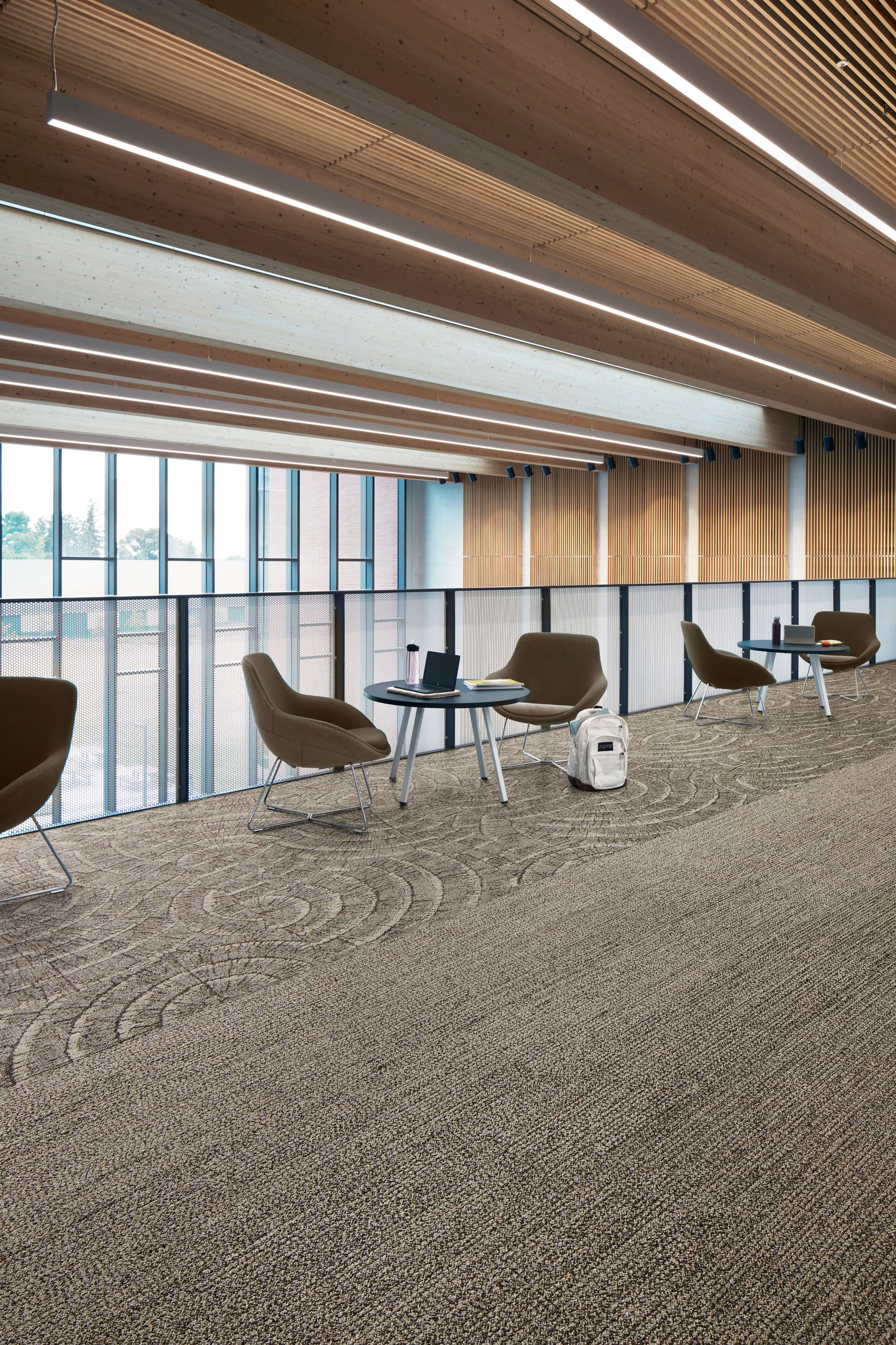 Interface EE710 carpet tile and EE715 plank carpet tile in workplace corridor with small seating areas image number 4