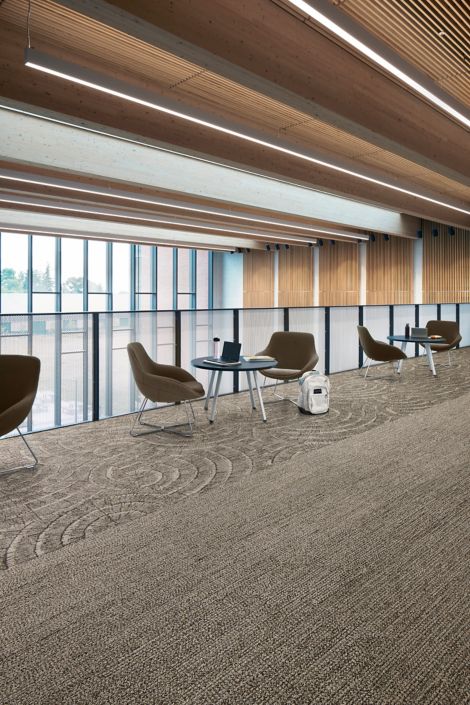 Interface EE710 carpet tile and EE715 plank carpet tile in workplace corridor with small seating areas image number 4