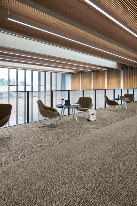 Interface EE710 carpet tile and EE715 plank carpet tile in workplace corridor with small seating areas image number 2