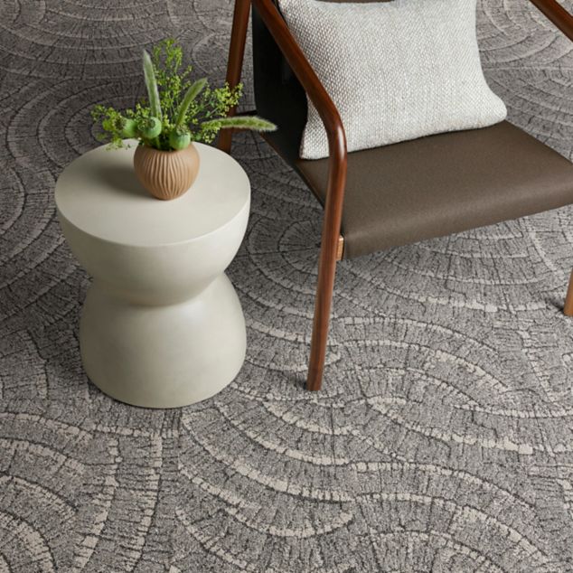 Interface EE710 carpet tile with chair and small table