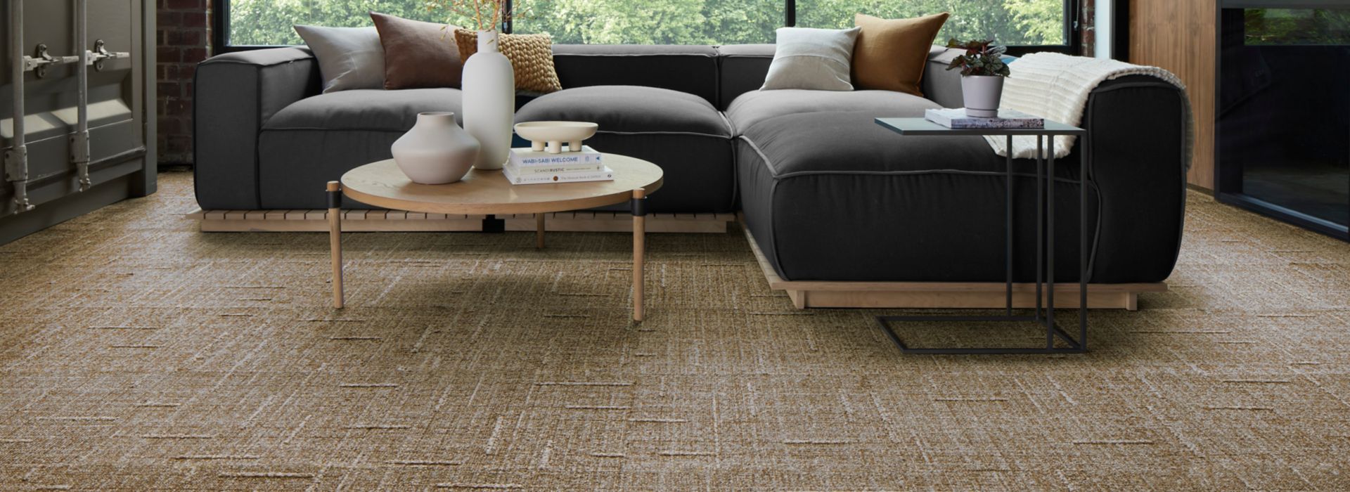 EE711 carpet tile in workplace lobby or lounge with glass walls and low wraparound sofa