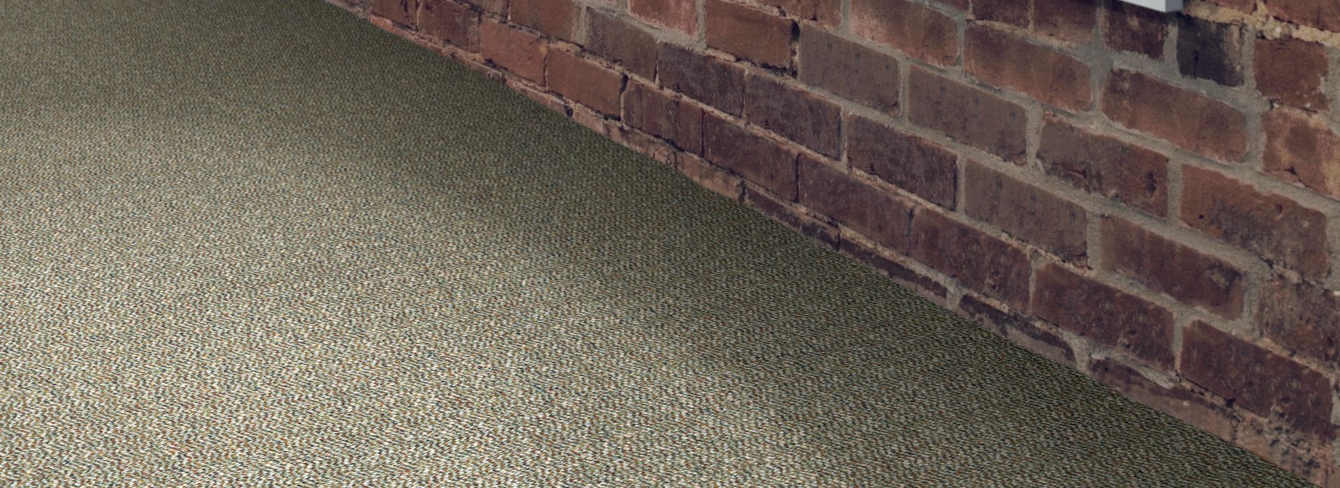 Interface Earth II carpet tile in room with brick wall and orange glass in window