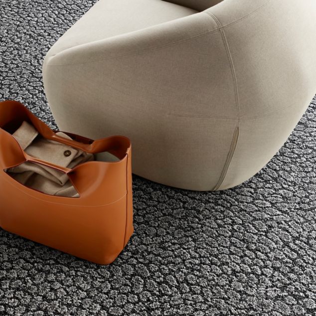 Interface E611 carpet tile detail with low chair and orange tote