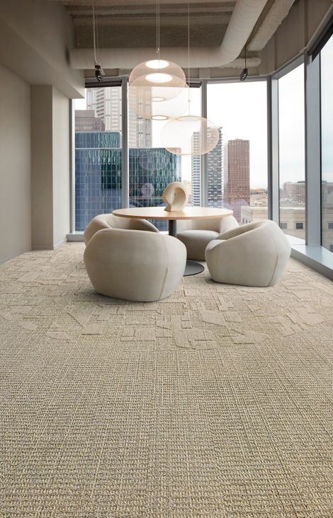 Interface E612 and E613 plank carpet tile in corporate small meeting area with wood table and sculpture image number 3