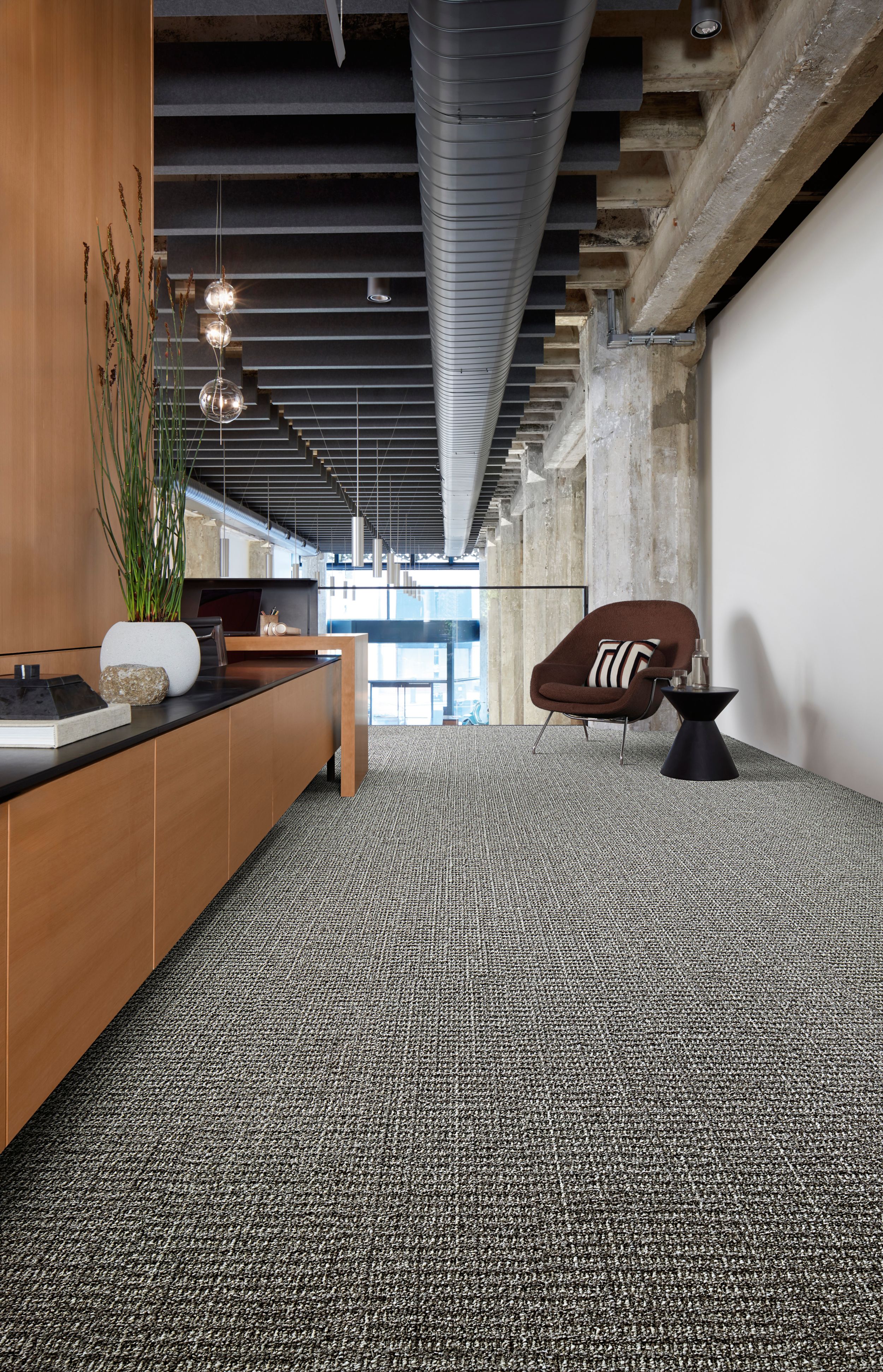 Interface E613 plank carpet tile in office corridor with credenza and small seating area image number 2