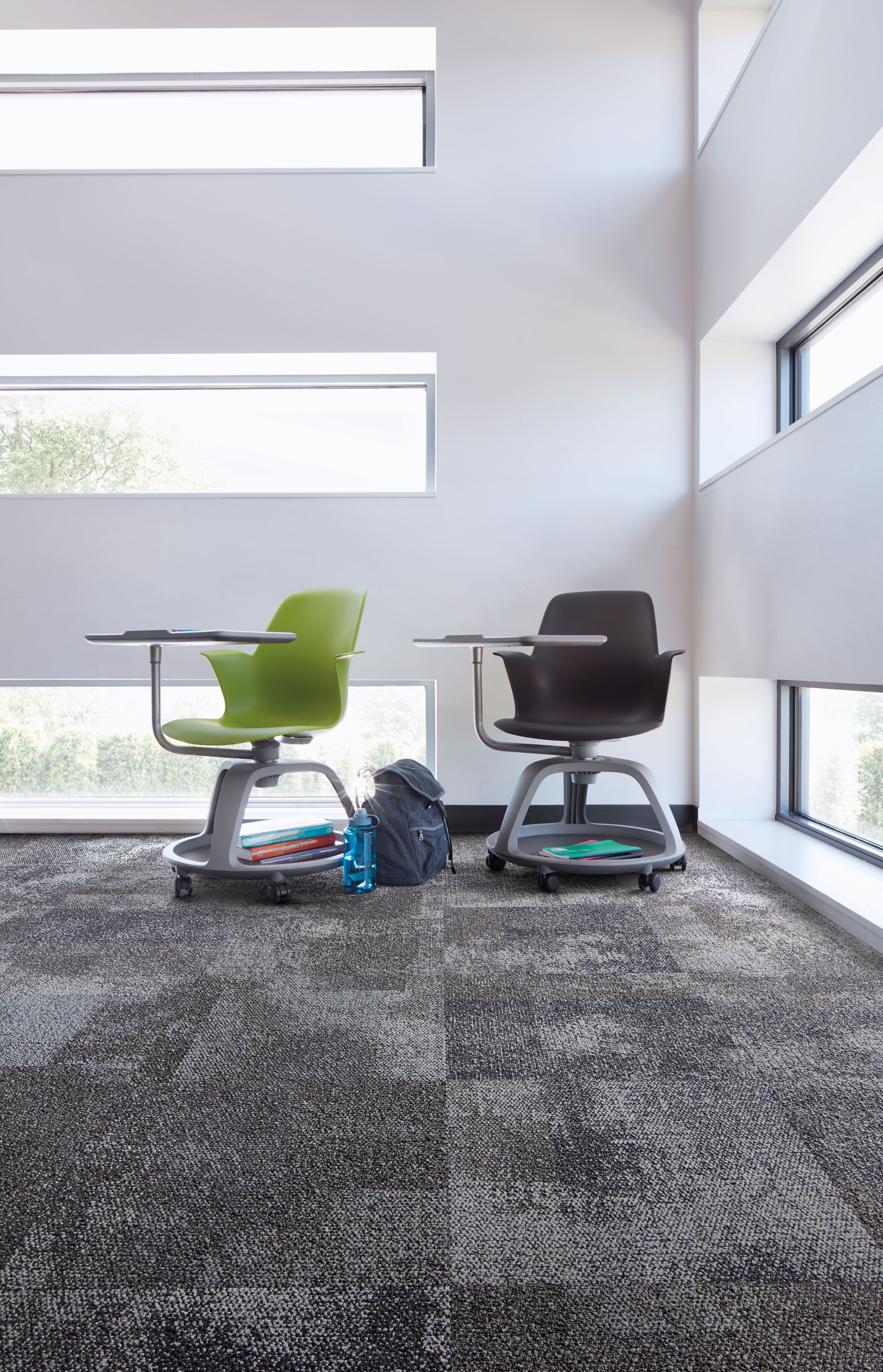 Interface Exposed carpet tile in corner with green and black school desks and horizontal windowns image number 2