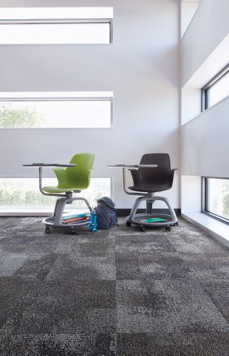 Interface Exposed carpet tile in corner with green and black school desks and horizontal windowns image number 2