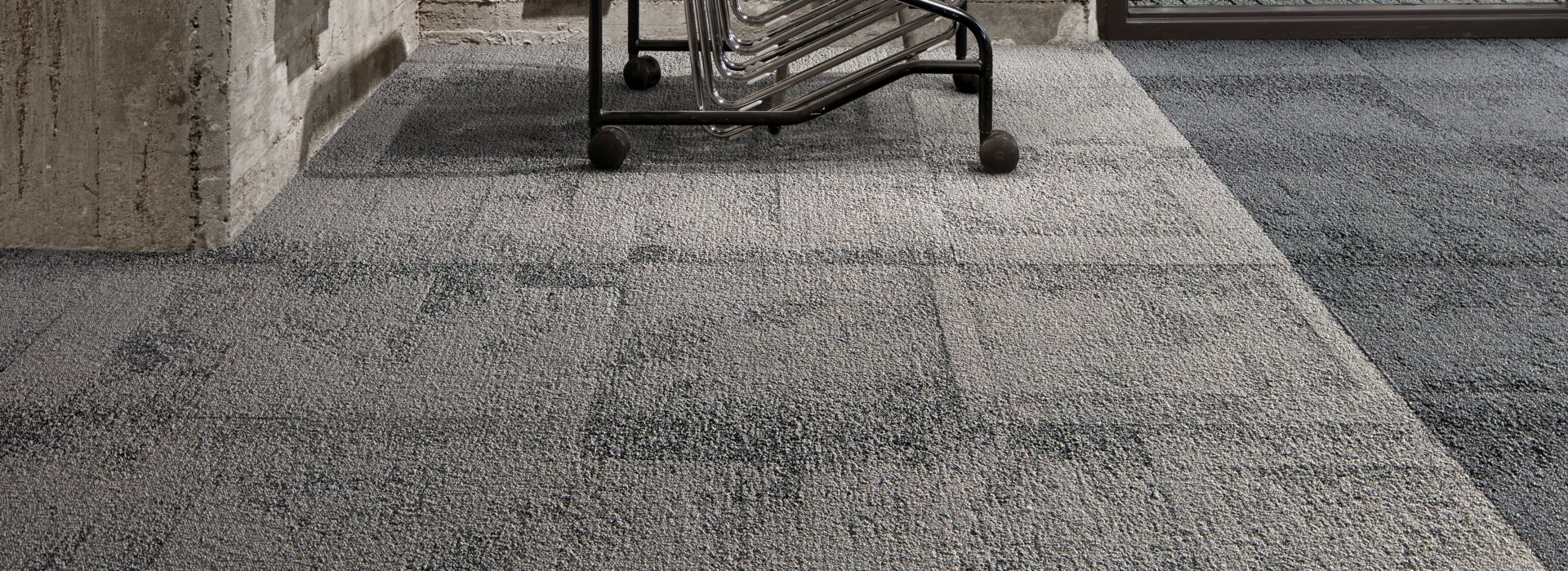 Interface Flagstone carpet tile with stack of chairs