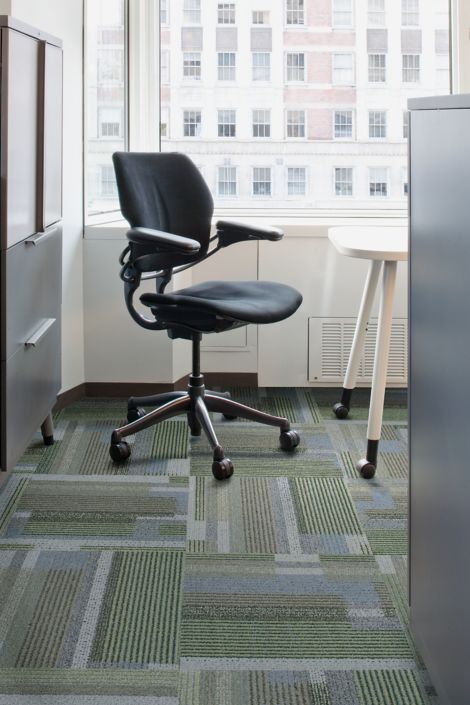 Interface Happening carpet tile in corner with office chair and file cabinet