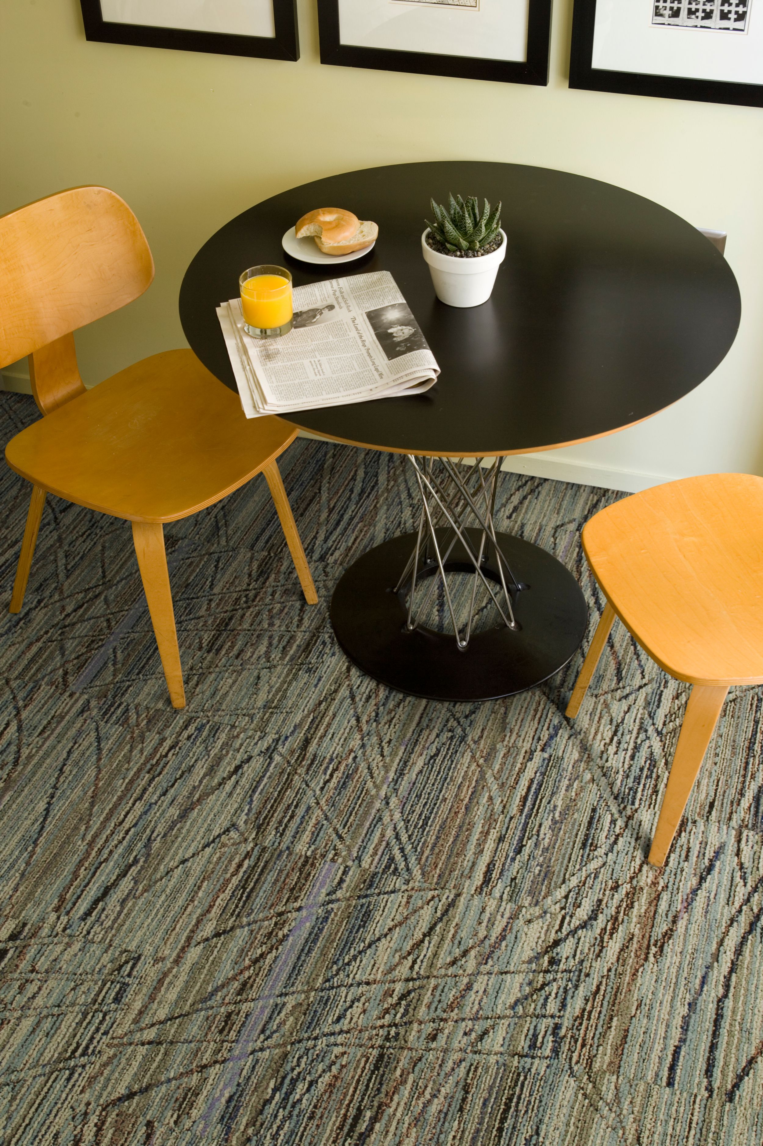 Detail of Interface Prairie Grass carpet tile in break area with table and two chairs image number 5