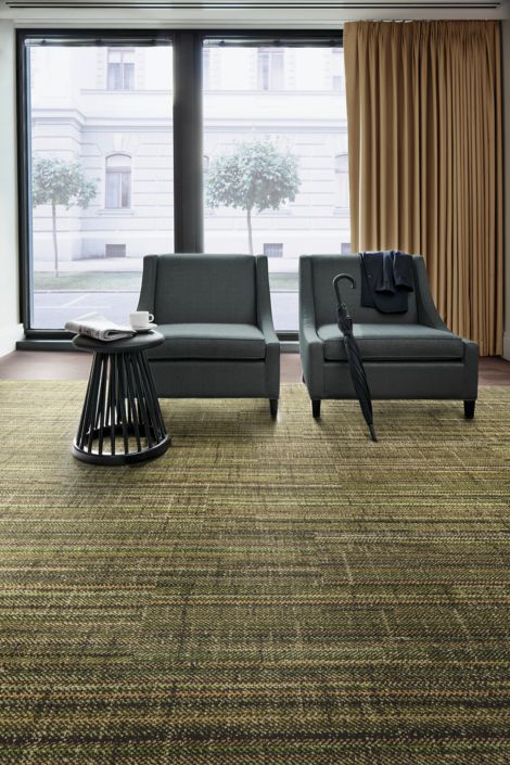 Interface French Seams plank carpet tile and Natural Woodgrains LVT with two chairs