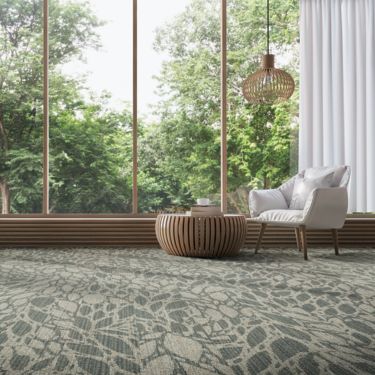 Interface GN157 plank carpet tile in public space with white accent chair imagen número 1