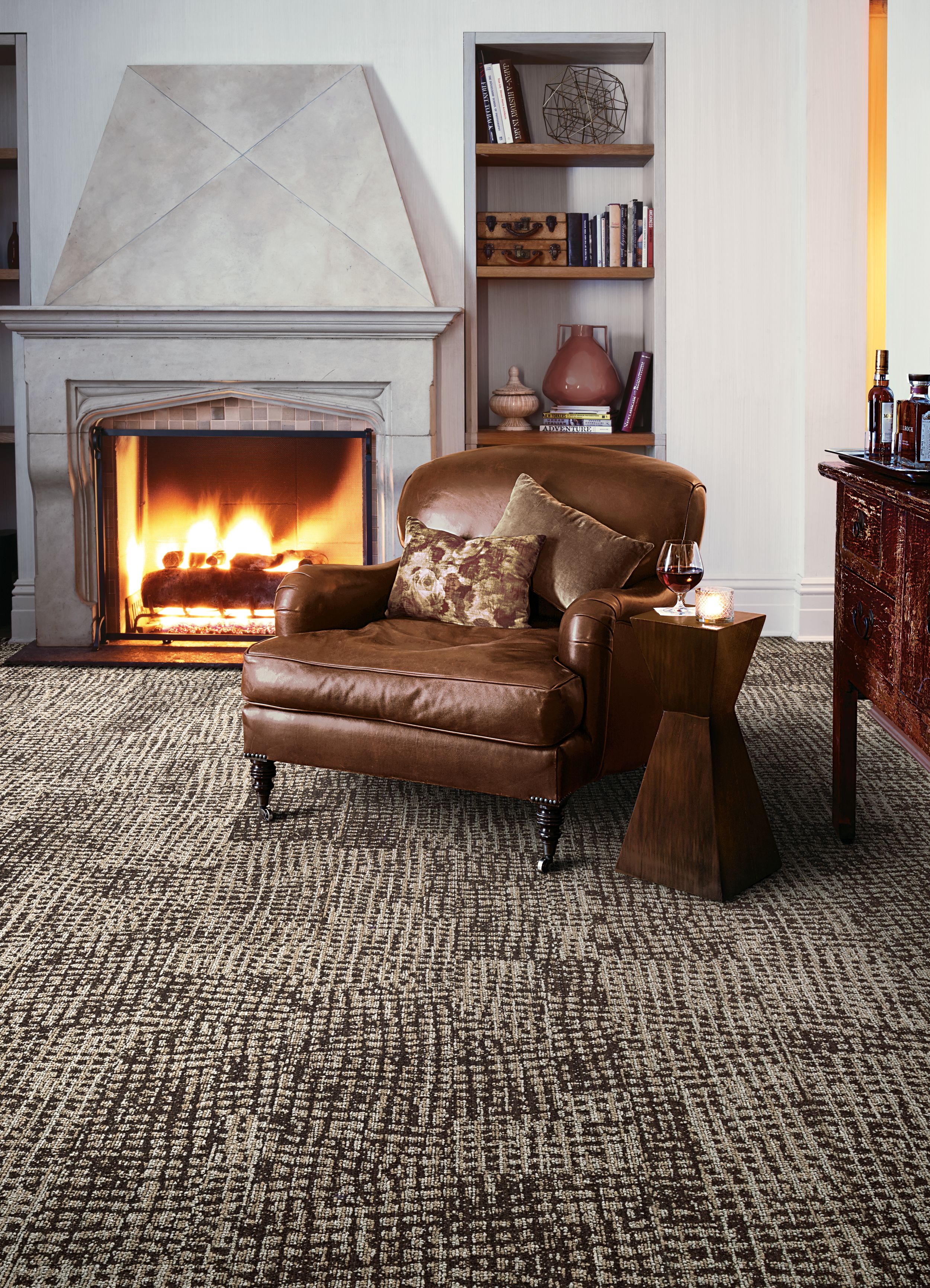 Interface GN160 plank carpet tile in lounge area by fireplace image number 1