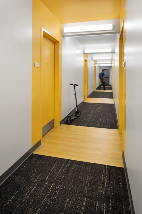 Interface Bitrate plank carpet tile and LVT in residence hall corridor