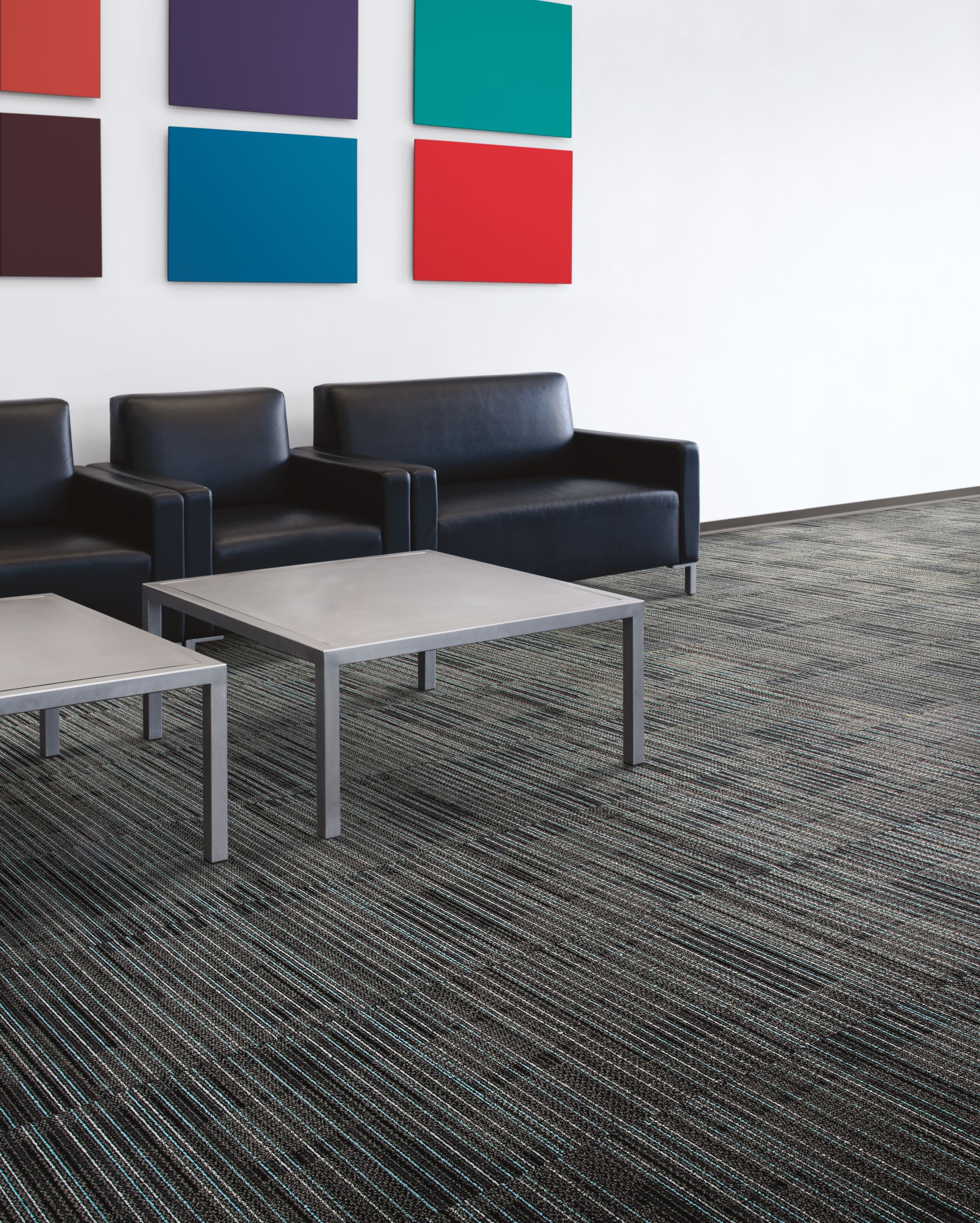 Interface Gather carpet tile in seating area with black chairs and colorful artwork image number 2