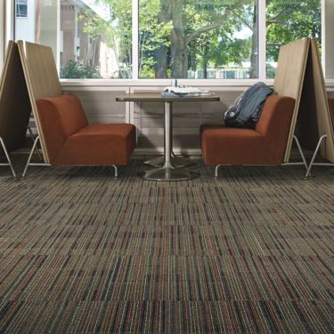 Interface Gather carpet tile with booths against large windows