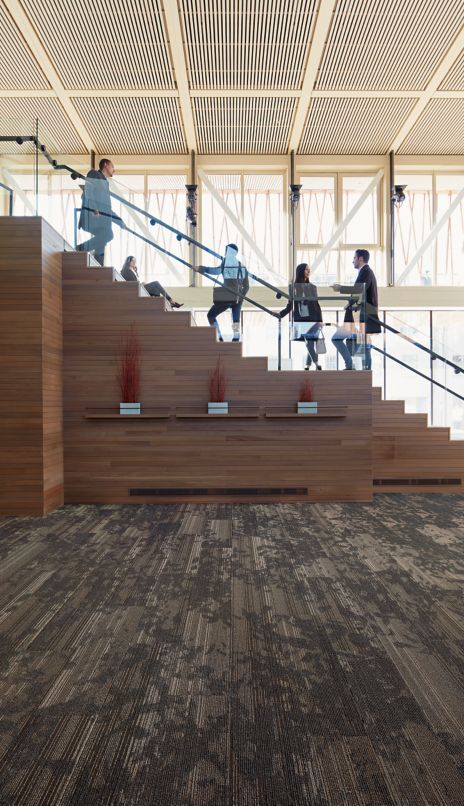 Interface Glazing plank carpet tile with wooden staircase in background