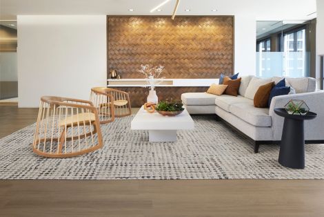 Interface Gossamer carpet tile with On Grain plank LVT in workplace lobby with exposed brick and modern furniture image number 5