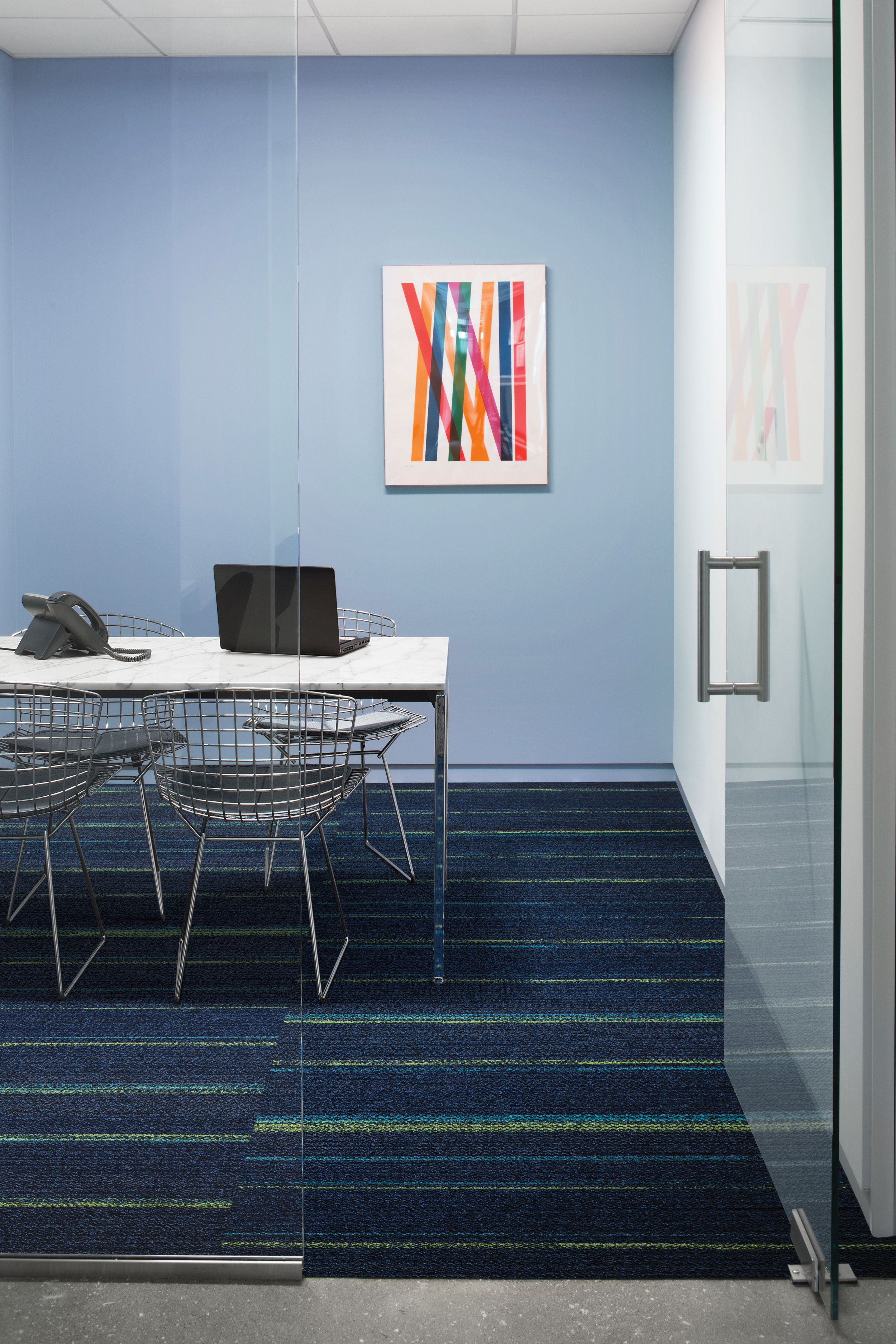 Ground Waves plank carpet tile in focus room with table, chairs and phone imagen número 1