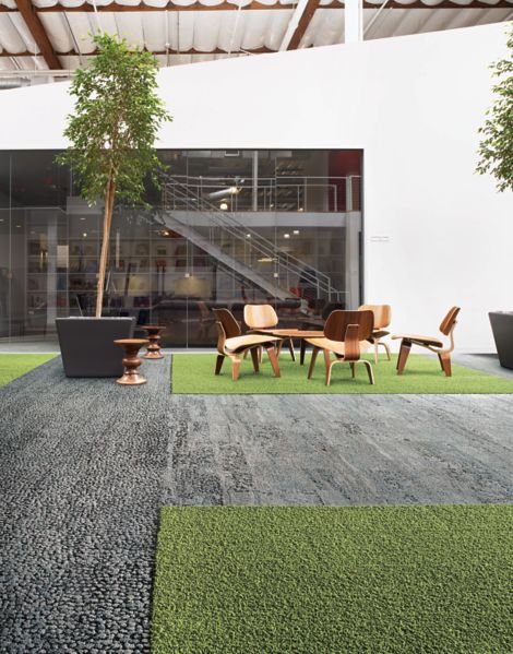 Interface HN810, HN830, HN840 and HN850 plank carpet tiles in open area with wood table and chairs and stairwell in the background número de imagen 7