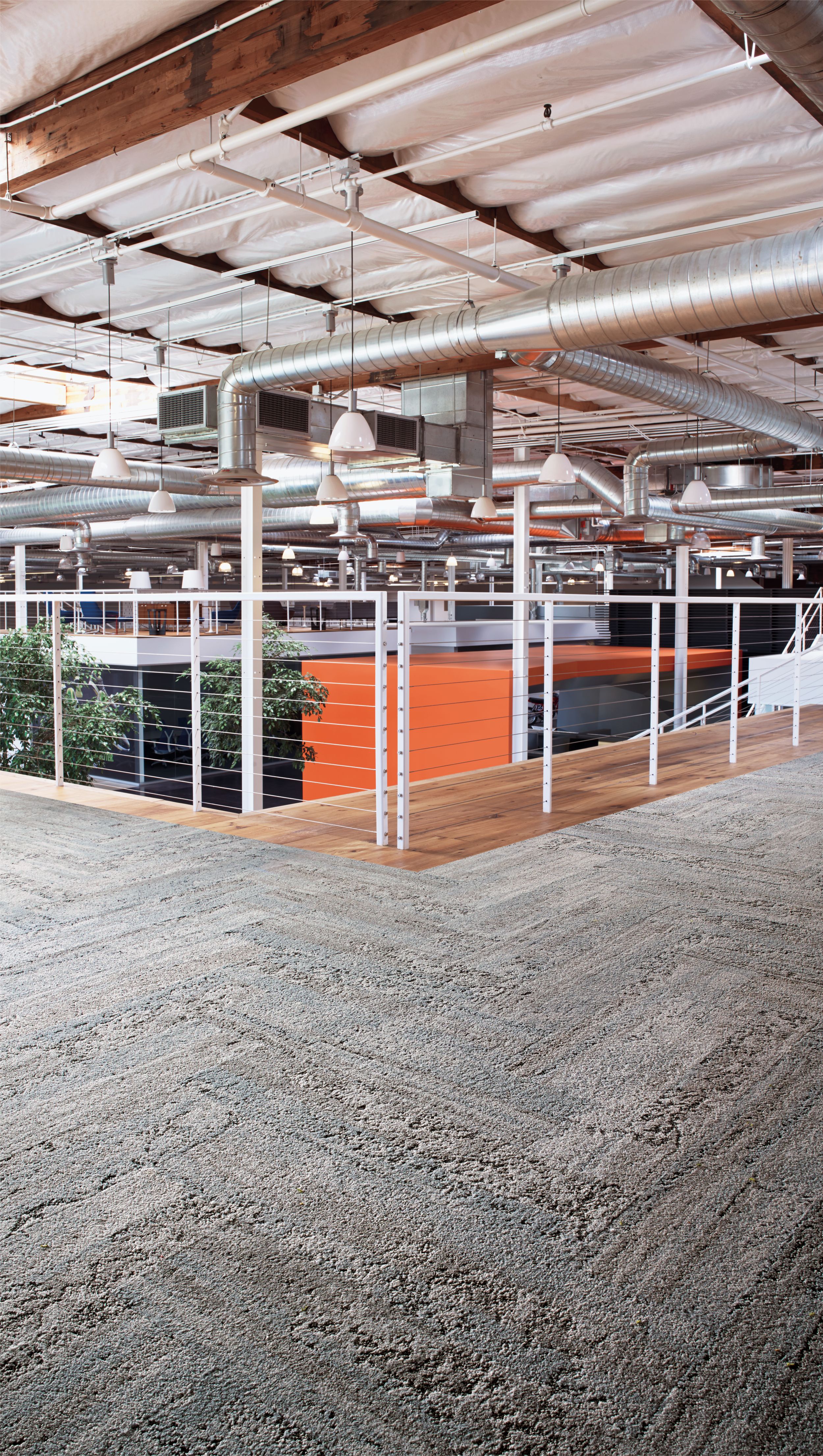 Interface HN810 plank carpet tile on balcony with wire railings and orange covered room below image number 1