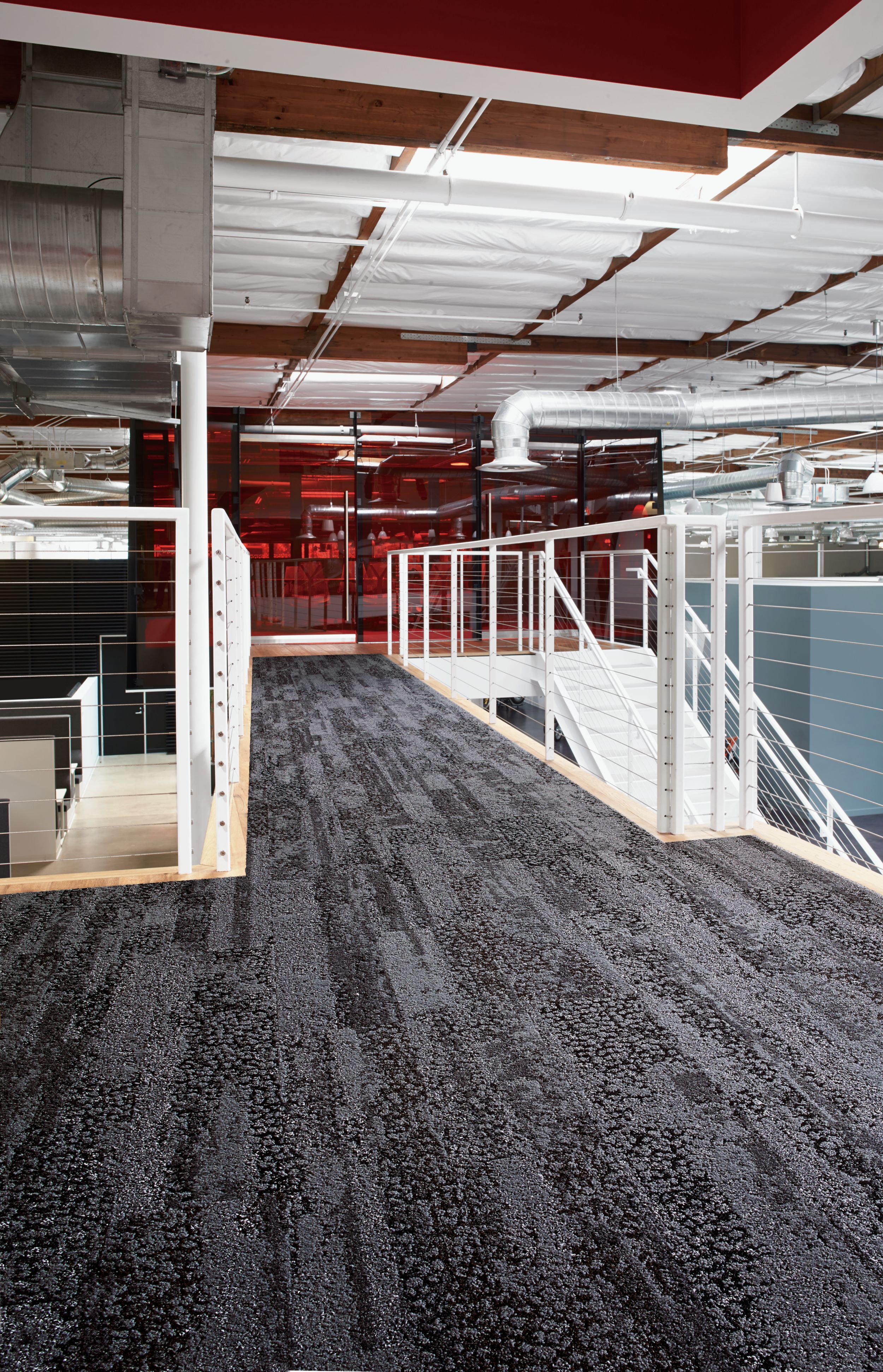 Interface HN850 plank carpet tile in upper level open stairwell with red glass meeting room in background número de imagen 1