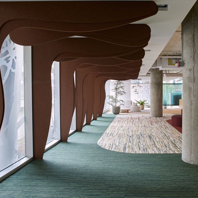 Interface Spruce it Up and Shifting Seasons plank carpet tile in corporate showroom corridor