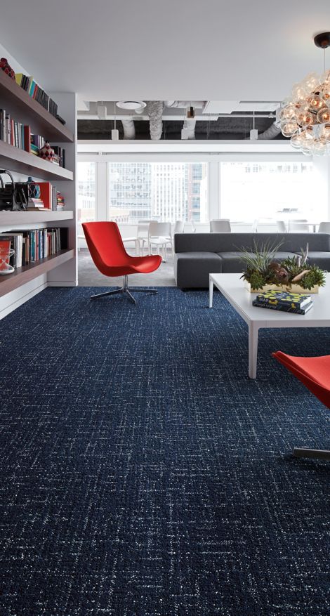 Interface Haptic plank carpet tile in lounge with built in shelves and red chair with Textured Stones LVT in background image number 2