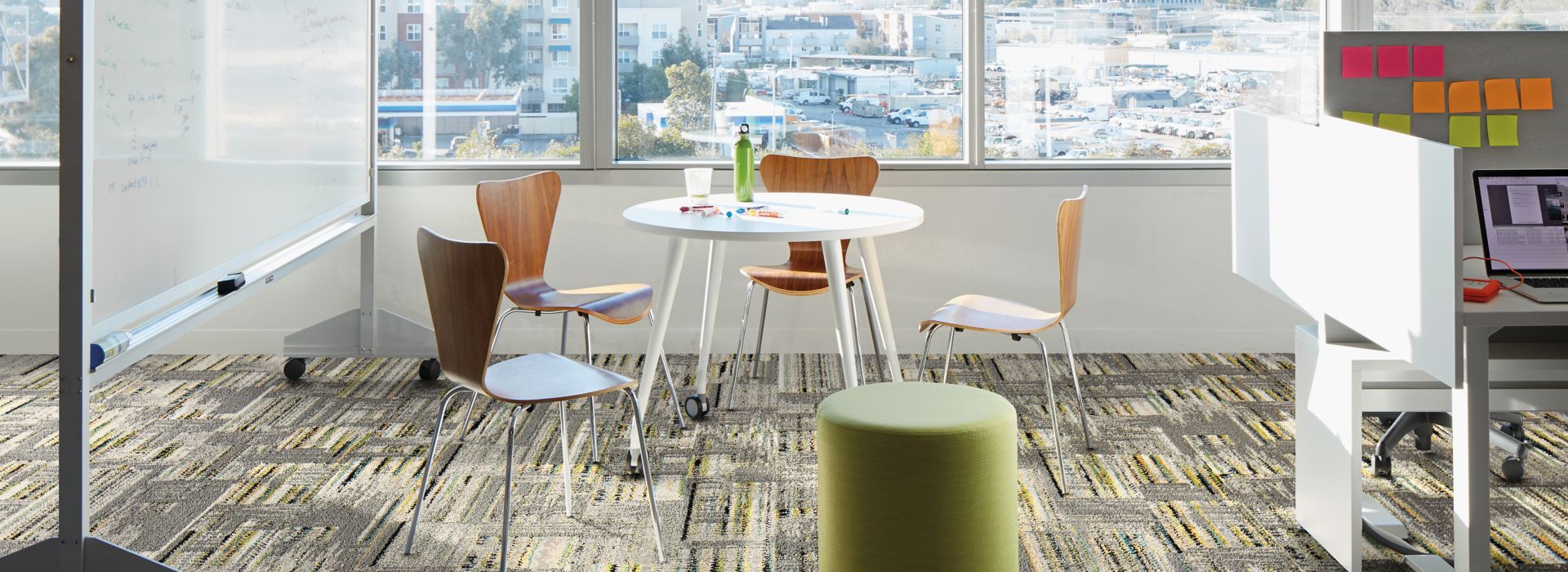 Interface Hard Drive plank carpet tile in collobaration space with whiteboard and small cubicle