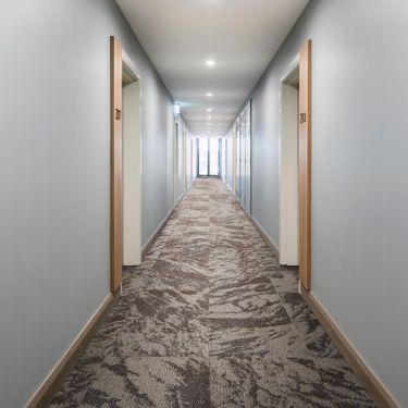 Interface Hard Truth carpet tile in corridor image number 2
