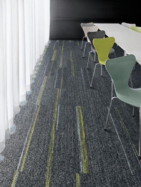 Interface Harmonize and Ground Waves plank carpet tile with multi-colored chairs at long table image number 6