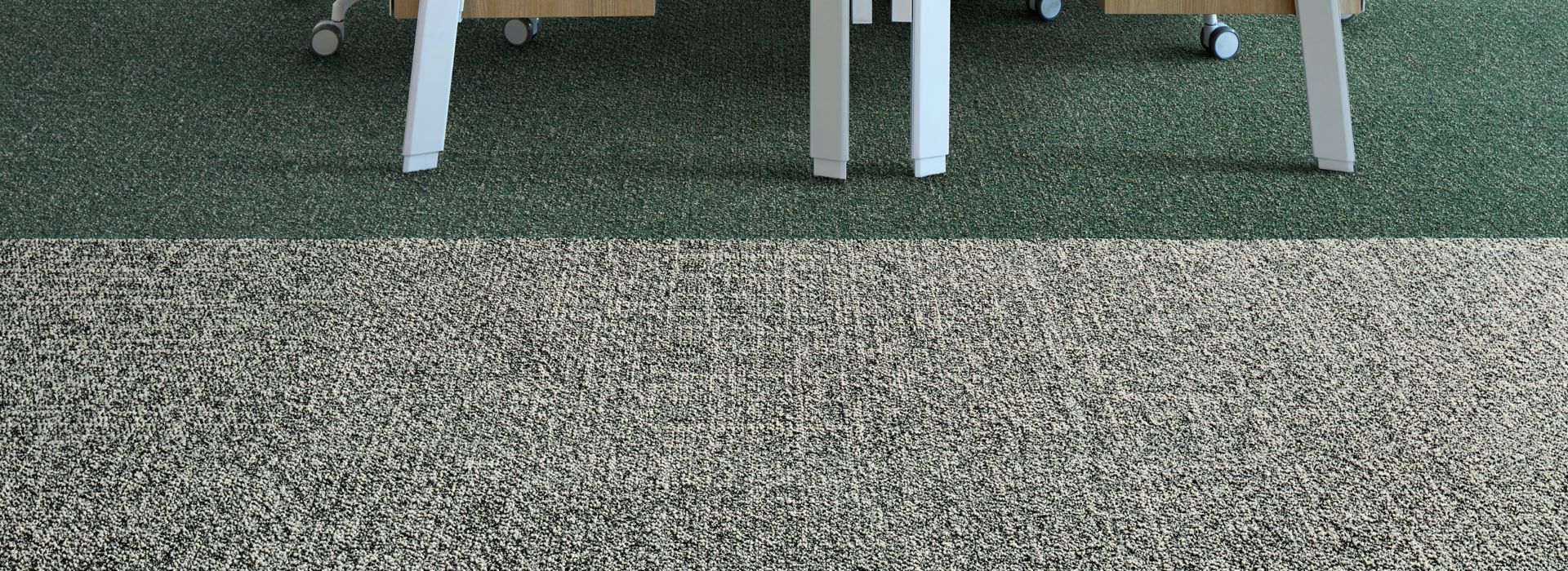 Interface Heart Songs carpet tile in workspace with two wood desks and chairs