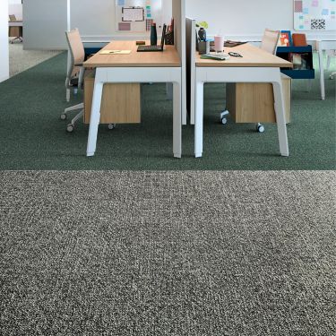 Interface Heart Songs carpet tile in workspace with two wood desks and chairs