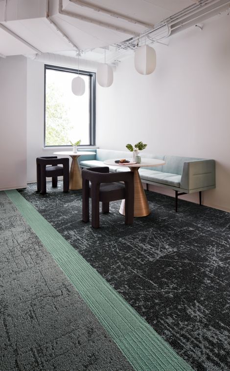 Interface Heartthrob carpet tile in corner dining space with cutlery on table