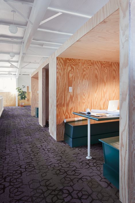 Interface Honey Do carpet tile in space with multiple booths for workspaces