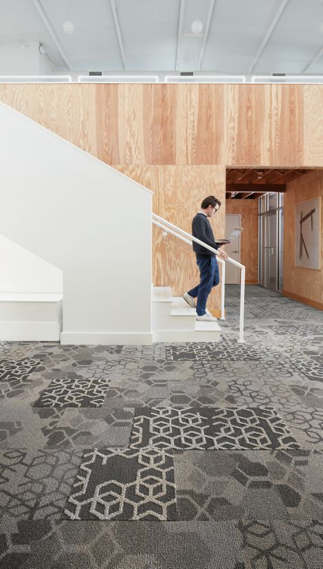 Interface Bee's Knees carpet tile and LVT in offiice with stairwell