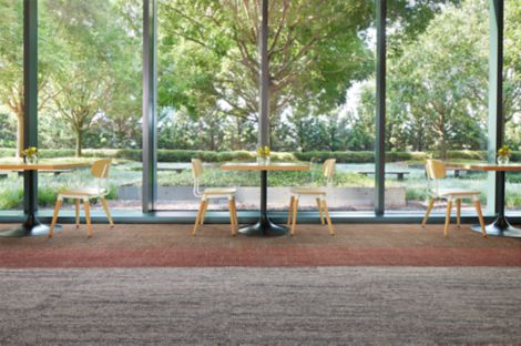 Interface Open Air Stria 402 and Open Ended carpet tile in lobby setting with tables and open plan windows