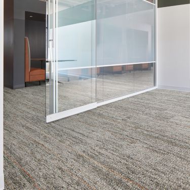 Interface Open Air 402 Stria carpet tile in office corridor under glass door